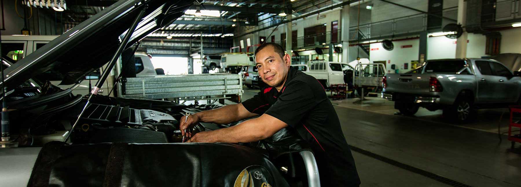 Mechanic working on a car in a workshop