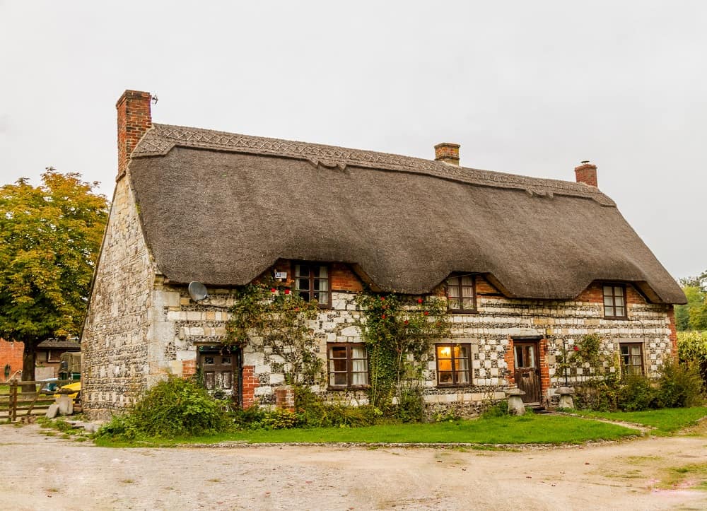 thatched-roof cottage with gingerbread-like feel